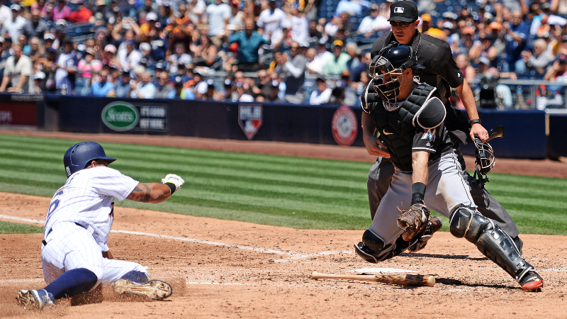 San Diego Padres third baseman Yangervis Solarte (left) and Miami Marlins catcher J.T. Realmuto