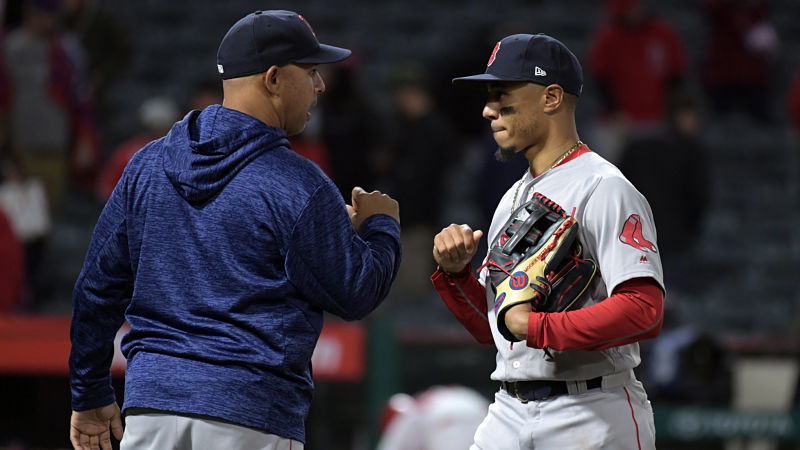Boston Red Sox manager Alex Cora and outfielder Mookie Betts