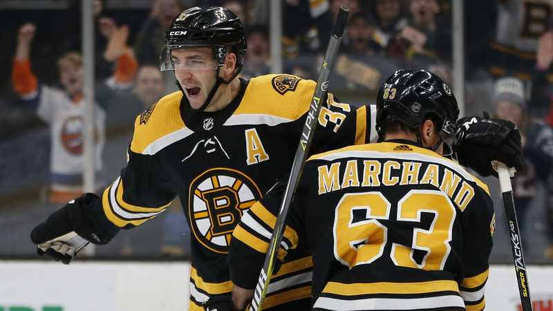 Bruins forwards Patrice Bergeron, Brad Marchand