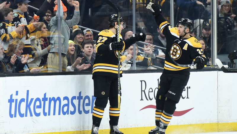 Boston Bruins Defenseman John Moore And Center Patrice Bergeron