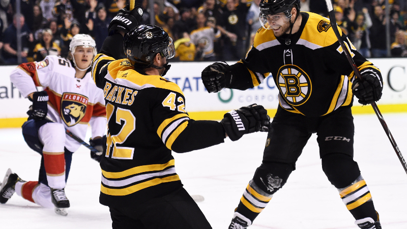Boston Bruins right wing David Backes (42) and left wing Jake DeBrusk