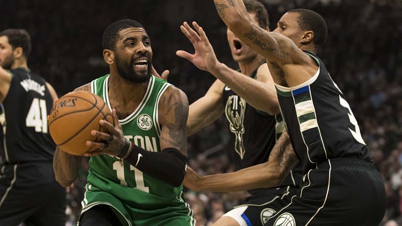 Boston Celtics guard Kyrie Irving and Milwaukee Bucks guard George Hill