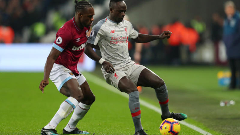 Liverpool forward Sadio Mane (right) midfielder Michail Antonio