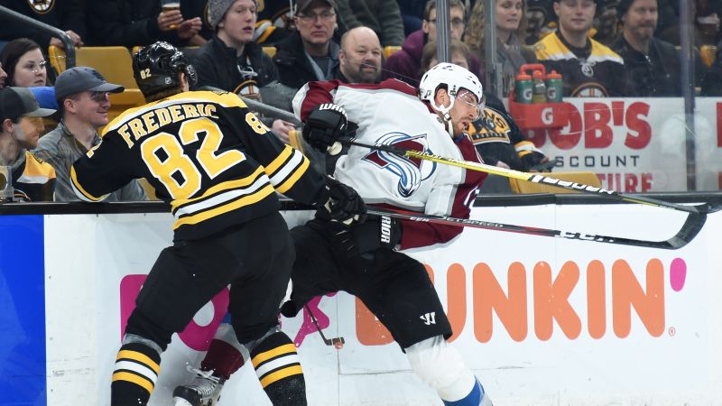 Boston Bruins center Trent Frederic (82) and Colorado Avalanche defenseman Patrik Nemeth (12)