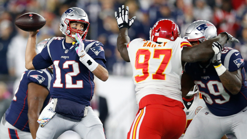 New England Patriots quarterback Tom Brady (12) and Kansas City Chiefs defensive end Allen Bailey (97)
