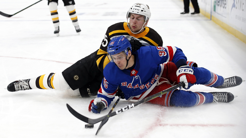 Bruins defenseman Brandon Carlo, Rangers forward Vinni Latteri