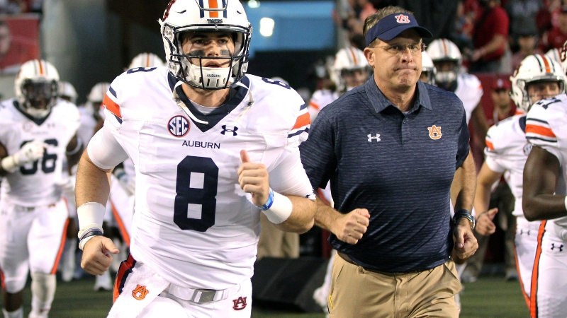 Ex-Auburn Tigers quarterback Jarrett Stidham (8) and current head coach Gus Malzahn