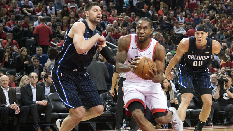 Orlando Magic forward Nikola Vucevic and Toronto Raptors forward Kawhi Leonard