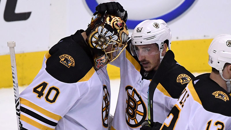 Boston Bruins goaltender Tuukka Rask, forward Brad Marchand