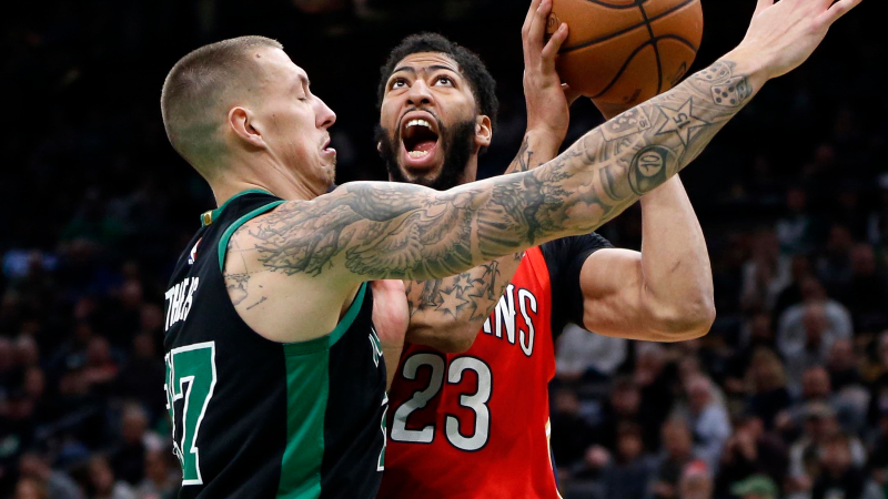 New Orleans Pelicans center Anthony Davis (23) and Boston Celtics center Daniel Theis (27)