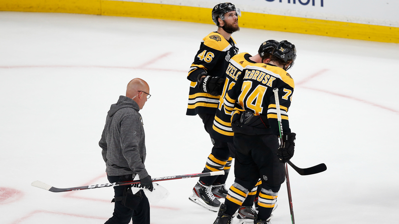 Boston Bruins' David Krejci, Matt Grzelcyk And Jake DeBrusk