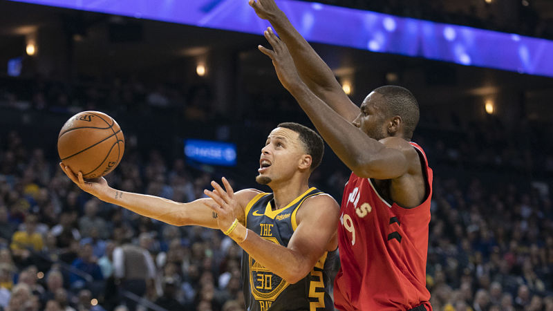 Golden State Warriors guard Stephen Curry and Toronto Raptors forward Serge Ibaka