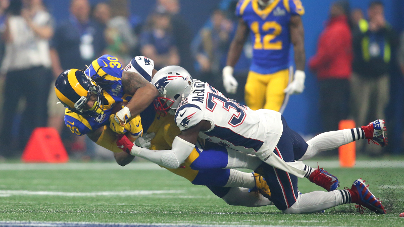 New England Patriots safety Devin McCourty (32) and os Angeles Rams running back Todd Gurley II (30)