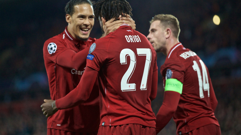Liverpool's Virgil van Dijk (left), Divock Origi (center) and Jordan Henderson