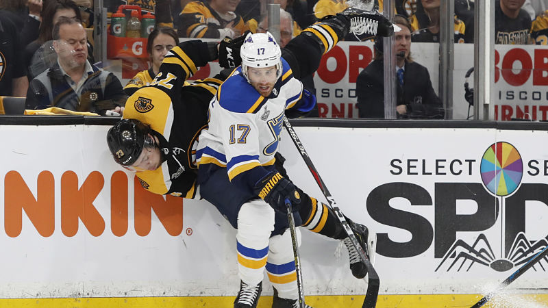 Boston Bruins defenseman Charlie McAvoy and St. Louis Blues forward Jaden Schwartz