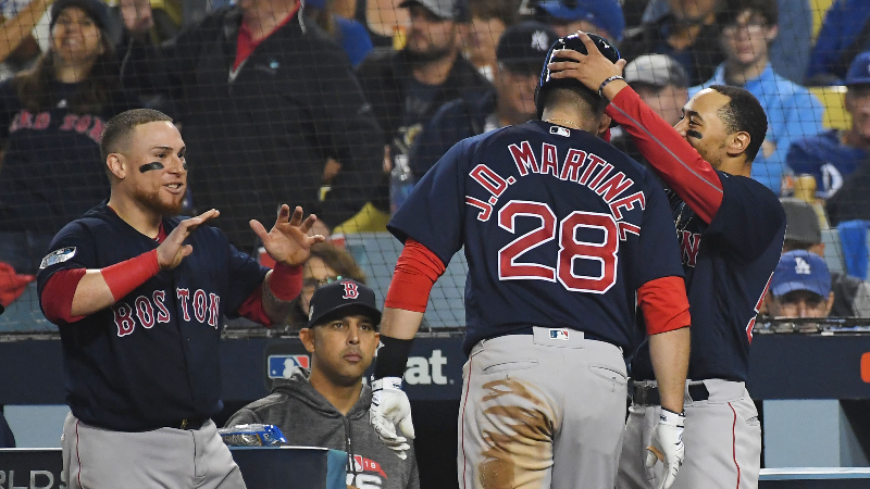 Boston Red Sox outfielder J.D. Martinez (28), catcher Christian Vazquez (left) and outfielder Mookie Betts (right)