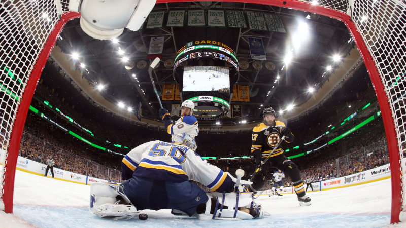 Boston Bruins Center Patrice Bergeron And St. Louis Blues Goalie Jordan Binnington