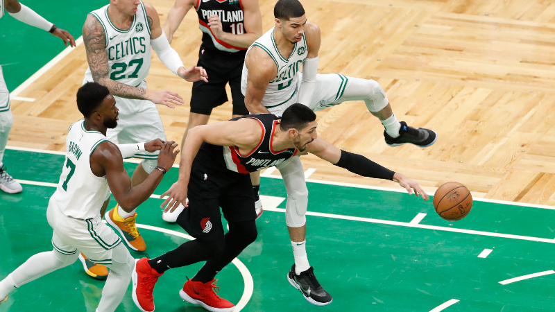 Boston Celtics forward Jayson Tatum (right), center Enes Kanter (center) and guard Jaylen Brown (left)