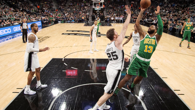 Former Boston Celtics forward Marcus Morris (13) San Antonio Spurs center Jakob Poeltl