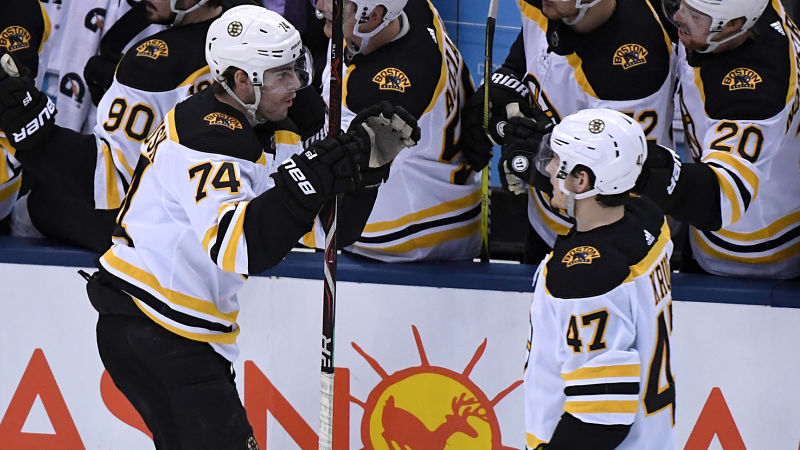 Boston Bruins players Jake DeBrusk and Torey Krug