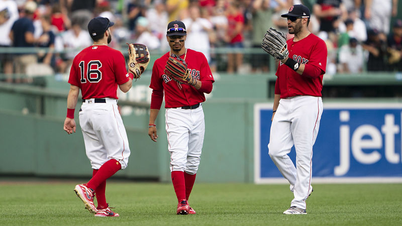 Boston Red Sox outfielders Andrew Benintendi, Mookie Betts and J.D. Martinez