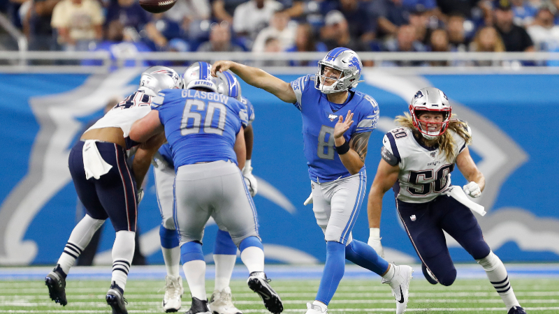 New England Patriots defensive end Chase Winovich (50) and Detroit Lions quarterback David Fales (8)