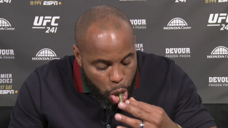 Daniel Cormier eats asparagus