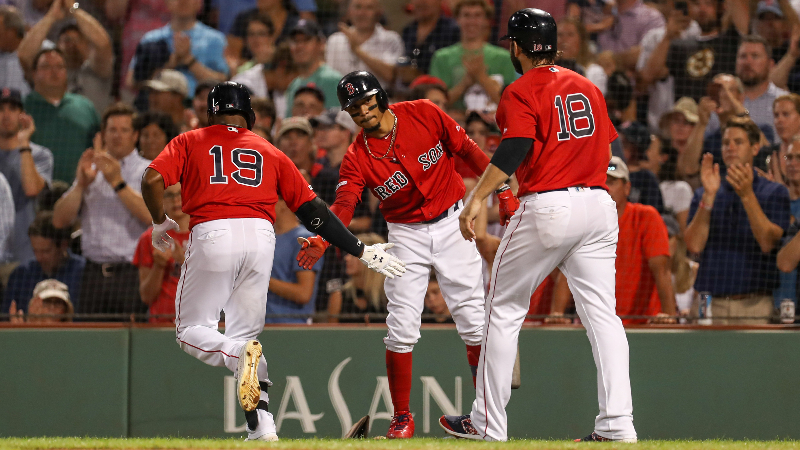 Boston Red Sox right fielder Mookie Betts (50), center fielder Jackie Bradley Jr. and designated hitter J.D. Martinez