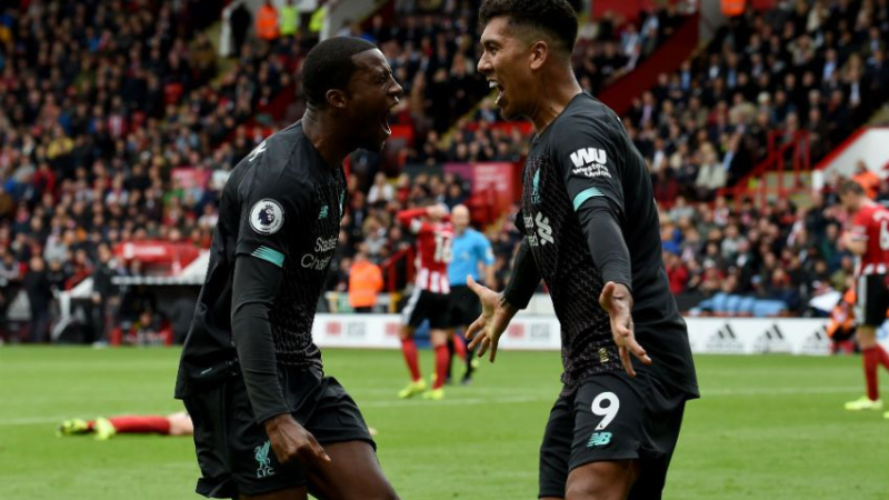 Liverpool midfielder Georginio Wijnaldum (left) and forward Roberto Firmino