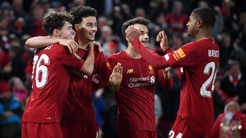 Liverpool defender Curtis Jones (second from left) and teammates