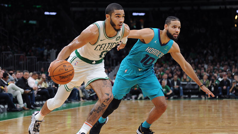 Boston Celtics forward Jayson Tatum and Charlotte Hornets forward Caleb Martin