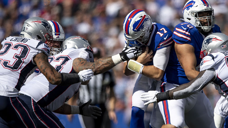 New England Patriots defensive tackle Lawrence Guy and Buffalo Bills quarterback Josh Allen