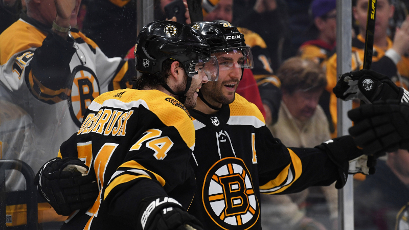Boston Bruins center Patrice Bergeron (37) and left wing Jake DeBrusk (74)