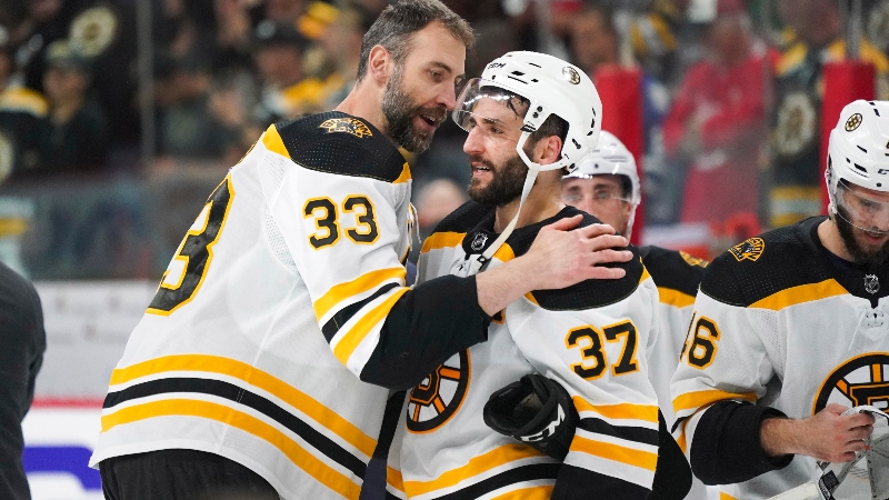Retired Boston Bruins defenseman Zdeno Chara, center Patrice Bergeron (37)