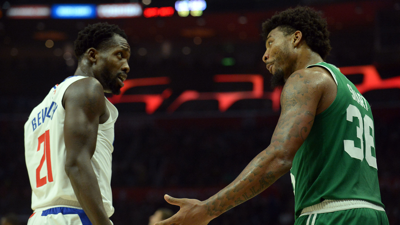 Celtics guard Marcus Smart, Clipper guard Patrick Beverly
