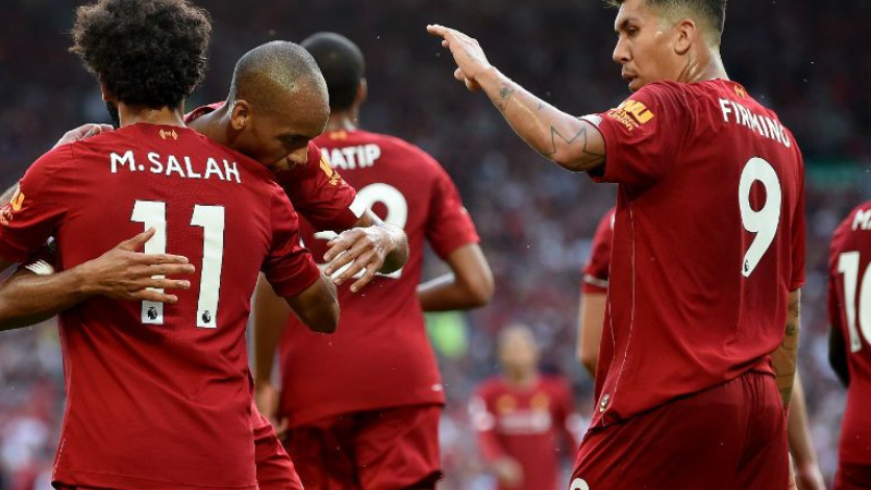 Liverpool forwards Mohamed Salah (left) and Roberto Firmino (right) and midfielder Fabinho (center)