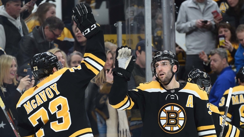 Boston Bruins Defenseman Charlie McAvoy And Center Patrice Bergeron