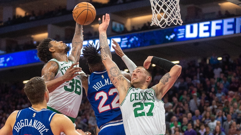 Boston Celtics guard Marcus Smart (36) and center Daniel Theis (27) and Sacramento Kings forward Richaun Holmes (22)