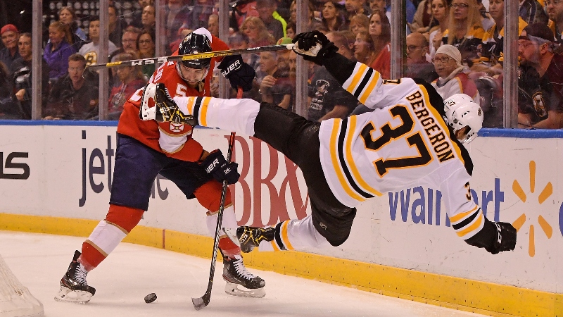 Florida Panthers defenseman Aaron Ekblad (5) and Boston Bruins center Patrice Bergeron (37)