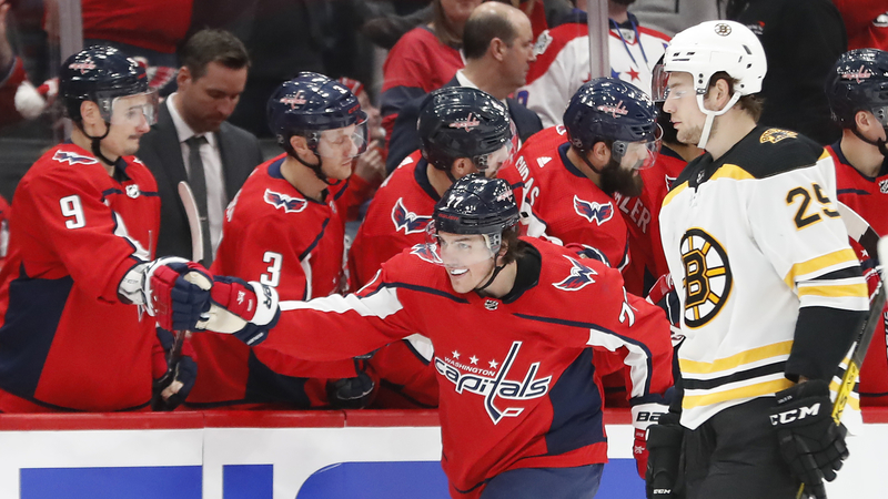 Washington Capitals Right Wing T.J. Oshie And Boston Bruins Defenseman Brandon Carlo