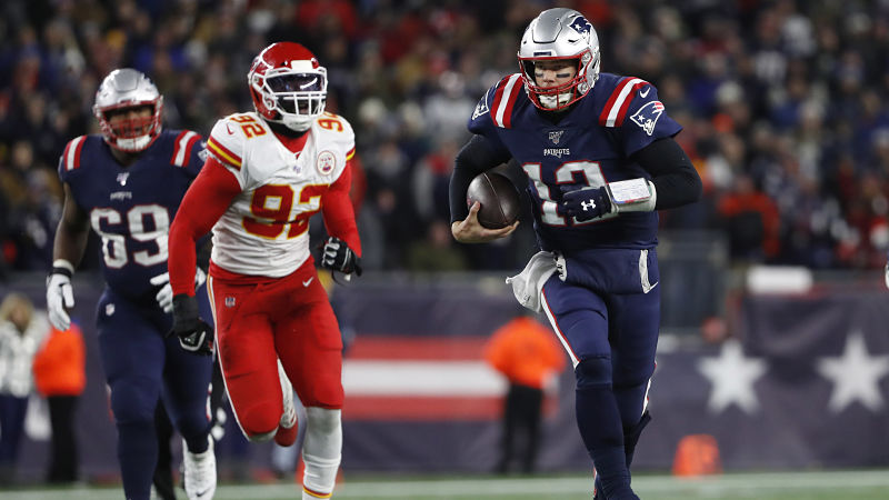 Kansas City Chiefs defensive lineman Tanoh Kpassagnon and New England Patriots quarterback Tom Brady