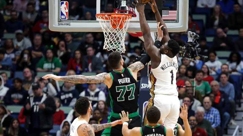 New Orleans Pelicans forward Zion Williamson (1) and Boston Celtics center Vincent Poirier (77)