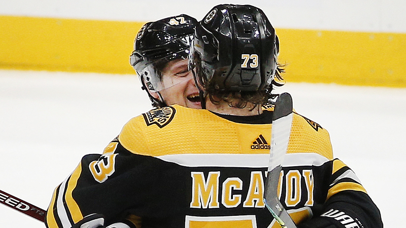 Bruins defensemen Charlie McAvoy and Torey Krug