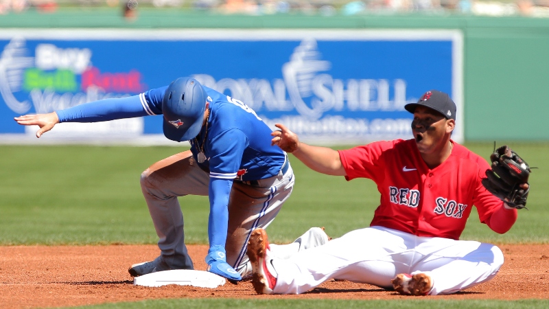 Boston Red Sox third baseman Rafael Devers (11) and Toronto Blue Jays second baseman Cavan Biggio (8)