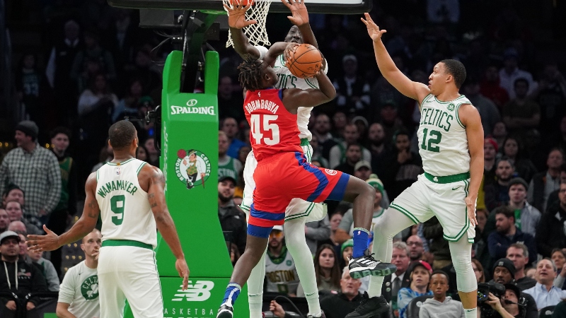 Boston Celtics center Tacko Fall (99) and forward Grant Williams (12) and Detroit Pistons forward Sekou Doumbouya