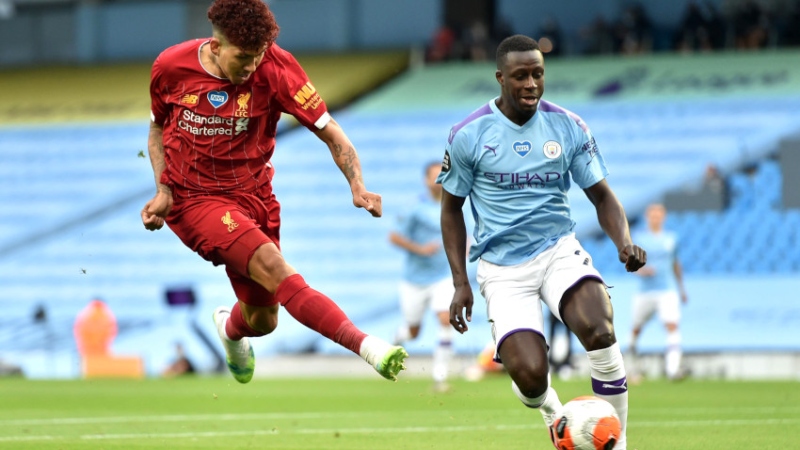 Liverpool forward Roberto Firmino (left) and Manchester City defender Benjamin Mendy