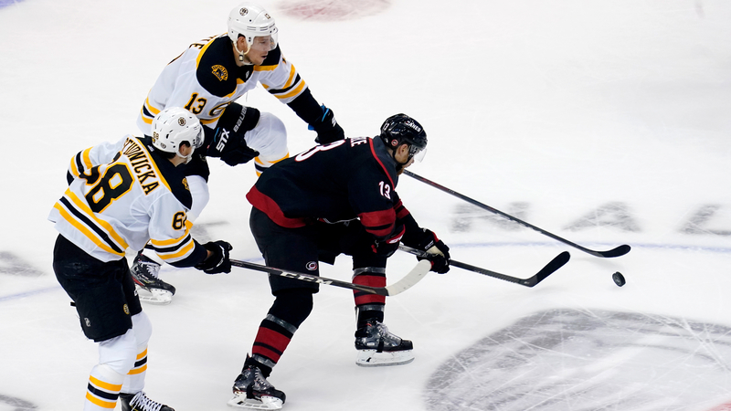 Boston Bruins forwards Jack Studnicka and Charlie Coyle, Carolina Hurricanes forward Warren Foegele