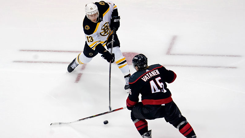 Boston Bruins center Charlie Coyle and Carolina Hurricanes defenseman Sami Vatanen