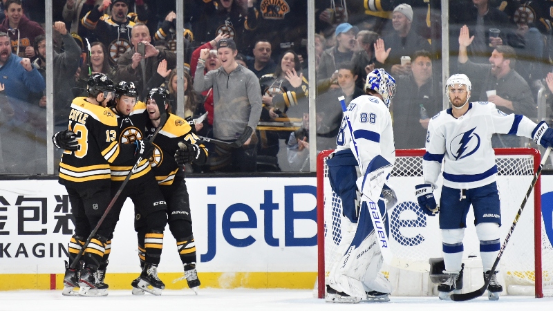 Boston Bruins defenseman Charlie McAvoy (73), center Charlie Coyle (13) and left wing Jake DeBrusk (74)