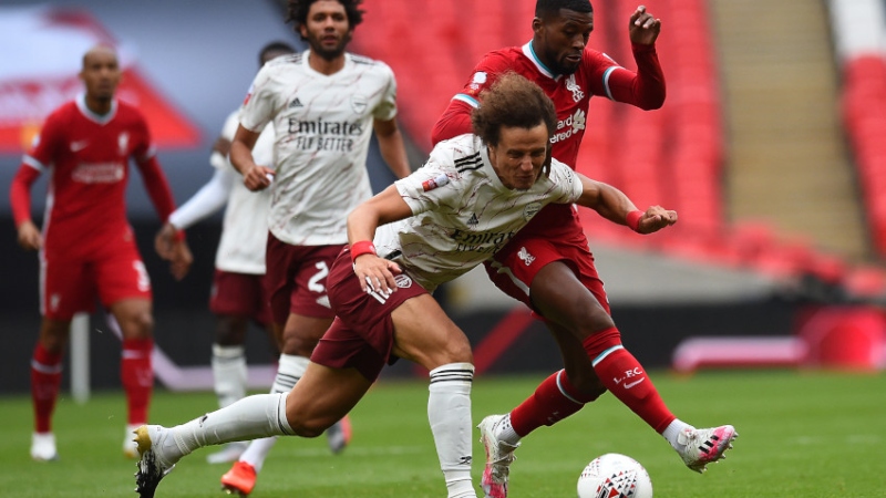 Liverpool midfielder Georginio Wijnaldum (right) and Arsenal defender David Luiz